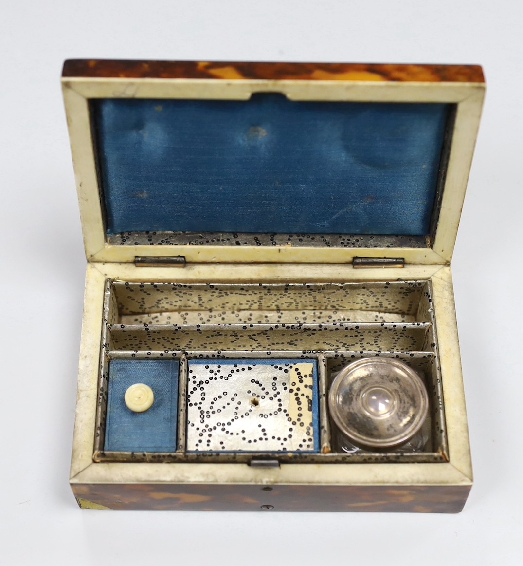 A Victorian tortoiseshell and ivory mounted pen and ink box, 10.5cm and a Chinese white metal telescopic tumbler in a tortoiseshell box